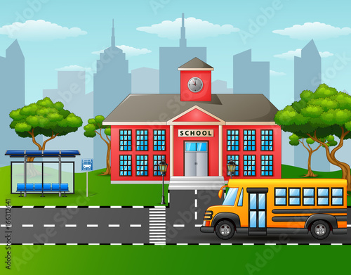 Yellow school bus in front of school building with bus stop