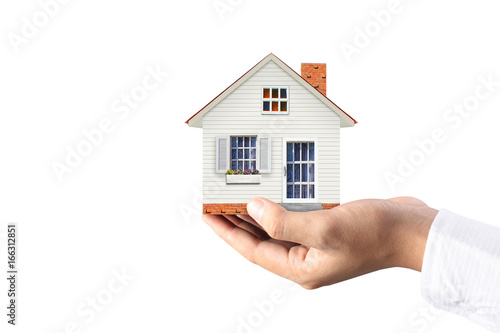 Mortgage concept by house from hand