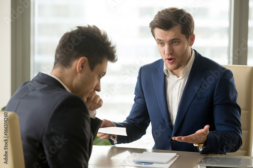 Obraz na plátně Angry mean boss yelling at employee for missing deadline, executive manager scol