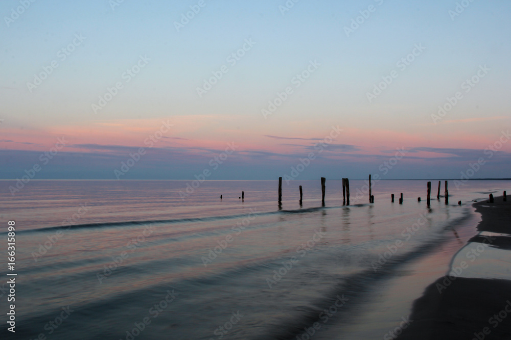 The pier on baltic sea, Melnsils, Latvia in sunrise