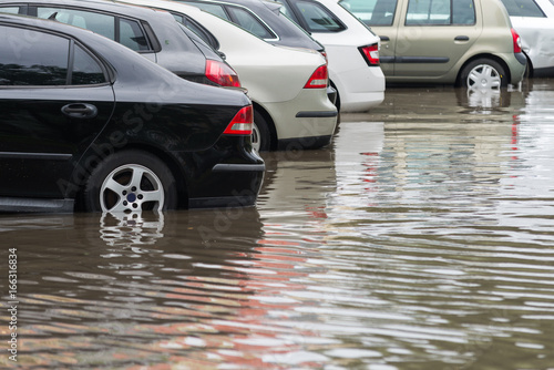car in water after heavy rain and flood