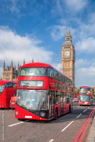 London with red buses against Big Ben in England  UK