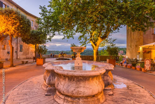 A fountain in a square in Pitigliano, a medieval village near Grosseto in Tuscany. photo
