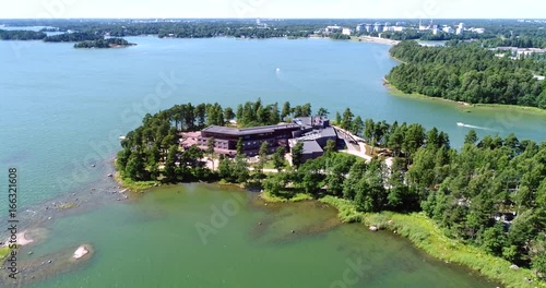 Hanasaari, Cinema 4k aerial view around a hotel on hanaholmen island, just outside helsinki, on a sunny day, in Espoo, Uusimaa, Finland photo