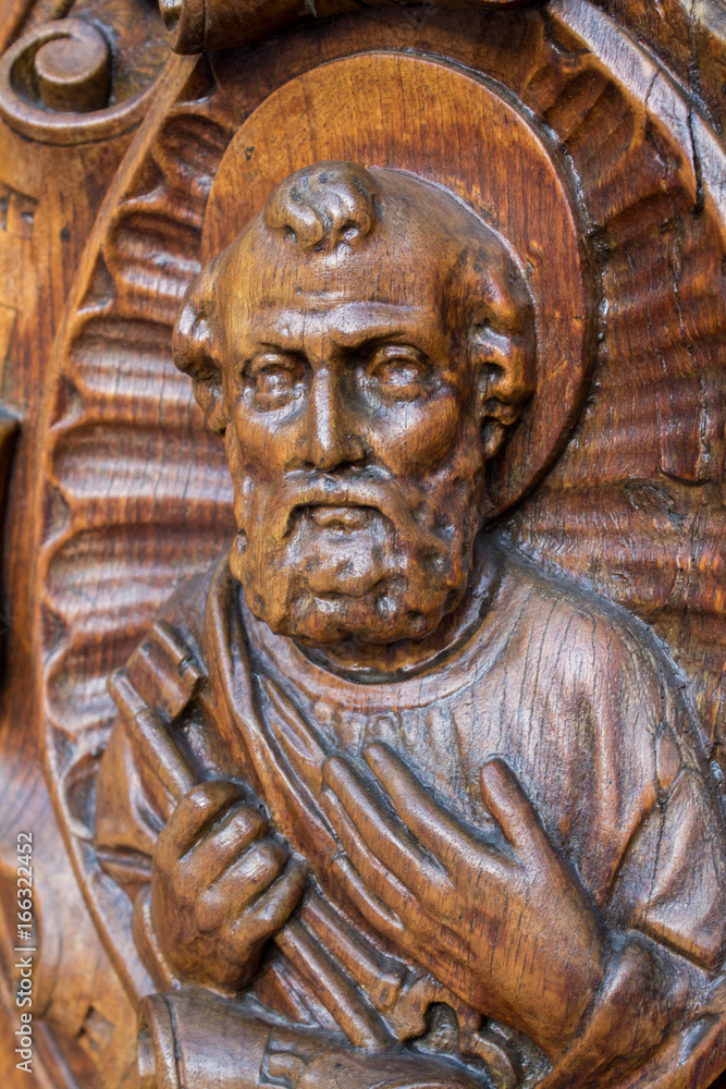 Wooden statue St Peter facing upwards