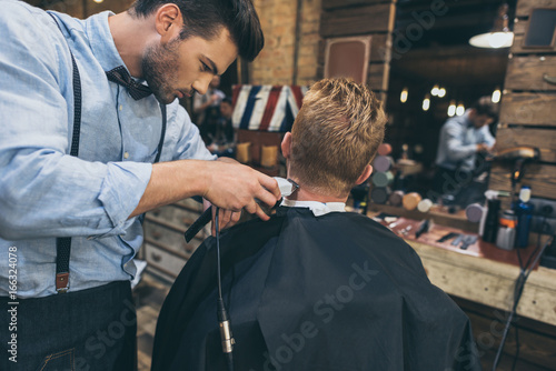 barber cutting hair of customer