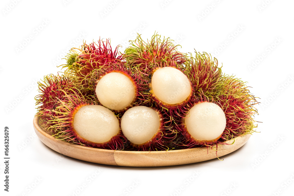Fresh Rambutan from Rayong Thailand on wooden plate isolated on white background Fresh Rambutan from Rayong Thailand on wooden plate isolated on white background