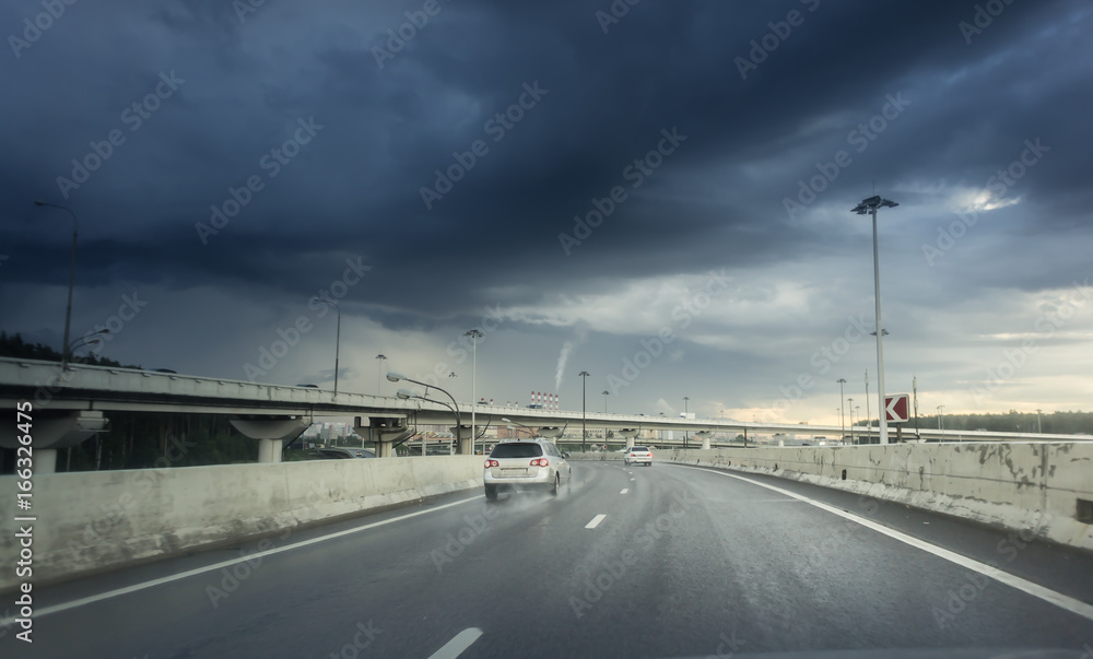 highway junction at the middle of the day. clouds and rain. Moscow