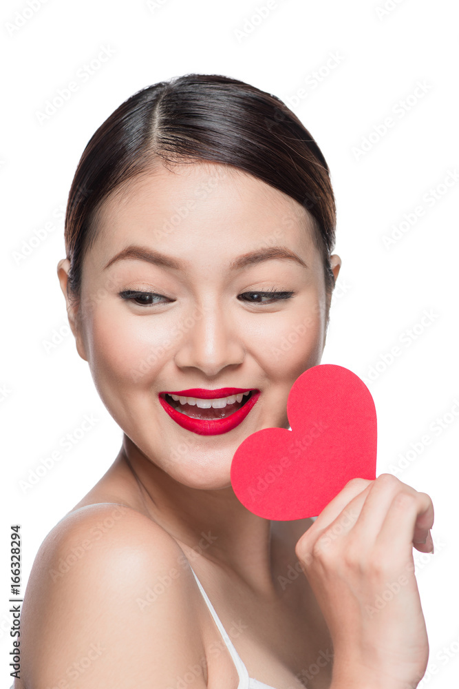 Attractive young woman with red heart. Valentine's day art portrait. Perfect make up Attractive young woman with red heart. Valentine's day art portrait. Perfect make up
