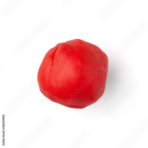 red piece of plastic on a white background © serguastock