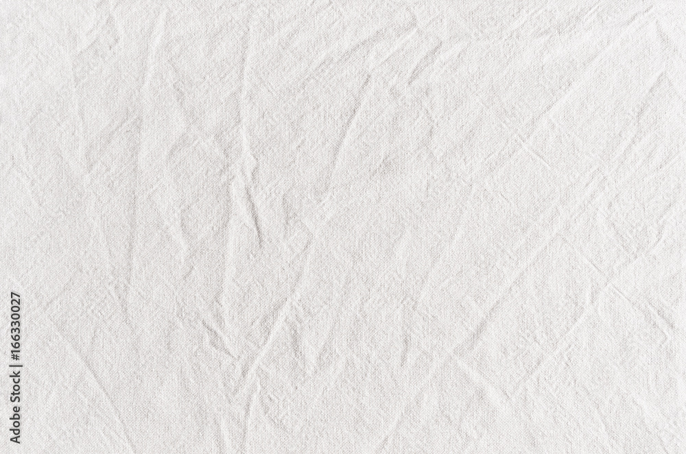White cotton canvas fabric texture with creases. White cotton canvas fabric texture with creases.