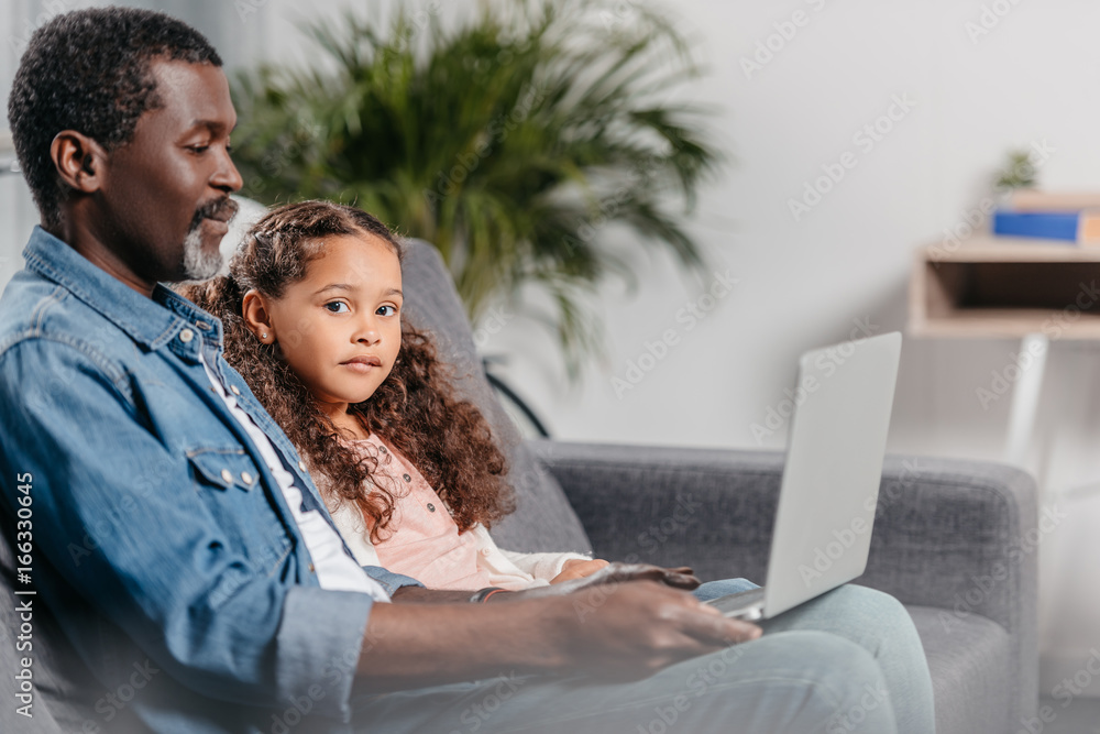 Father with daughter using laptop Father with daughter using laptop
