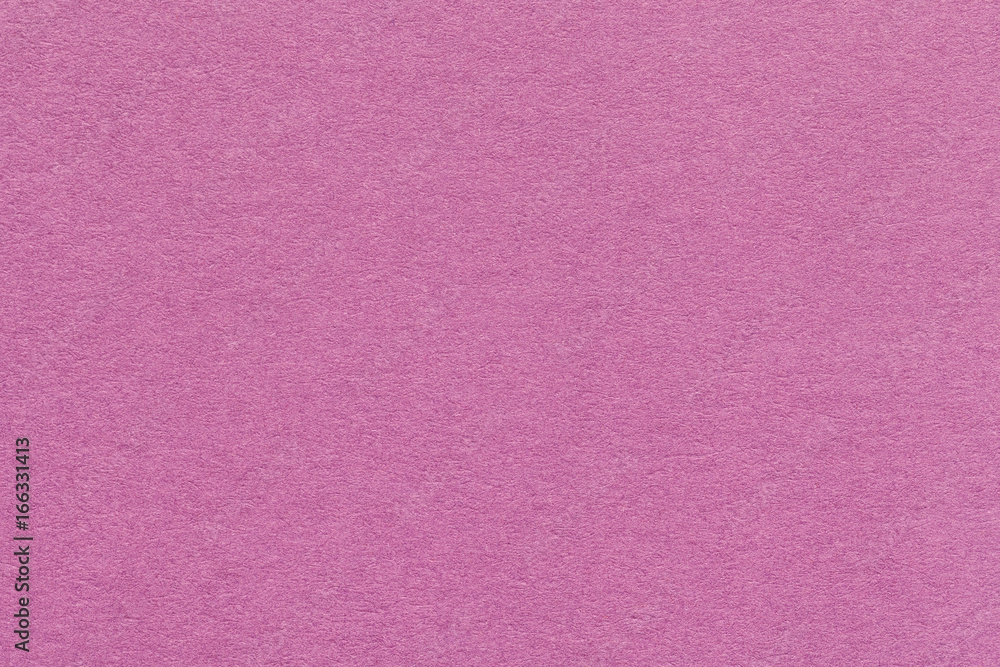 Texture of old dark pink paper closeup. Structure of a dense cardboard. The rose background. Texture of old dark pink paper closeup. Structure of a dense cardboard. The rose background.