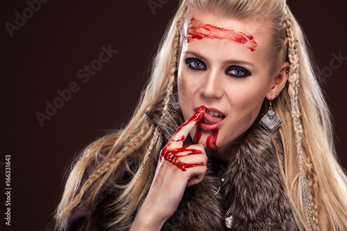 Fototapeta Portrait of viking woman in a traditional warrior clothes