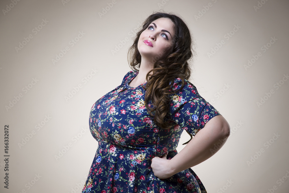 Plus size fashion model in casual clothes, fat woman on beige background, overweight female body Plus size fashion model in casual clothes, fat woman on beige background, overweight female body