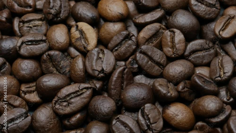 Roasted coffee beans on dark background. Dolly shot.
Roasted coffee beans on dark background. Dolly shot.