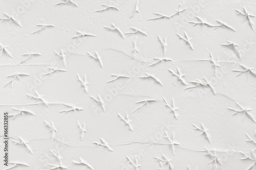 White decorative abstract plaster texture with cracks  splash  footprints.