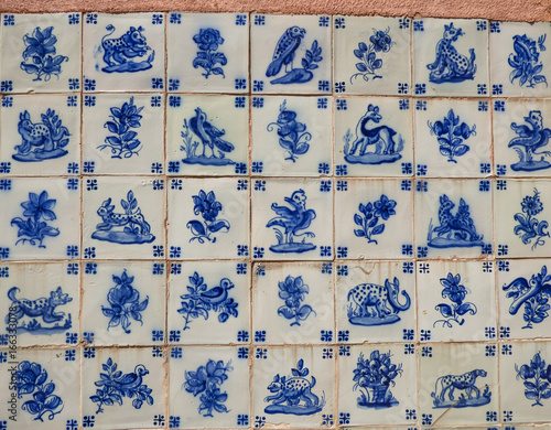Blue vintage Portuguese tiles (azulejos) with animal drawings in Cascais, Portugal
