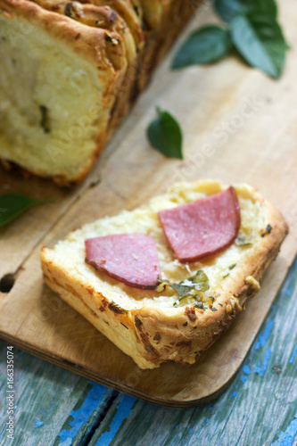 Homemade bread with cheese, salami and herbs