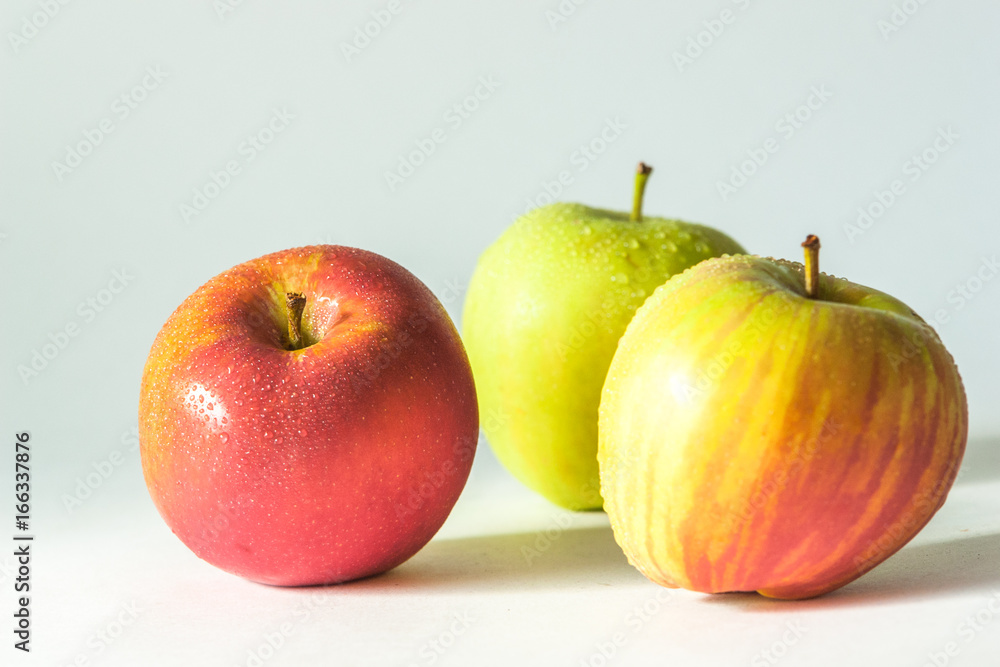3 apples with water droplets on white background 3 apples with water droplets on white background