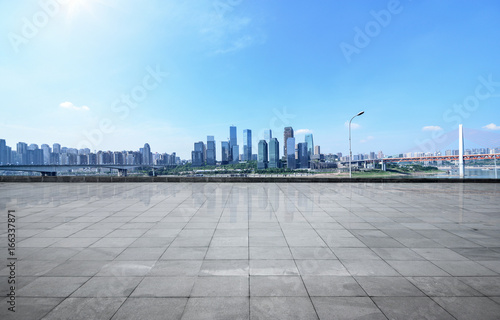 Panoramic skyline and buildings with empty concrete square floor