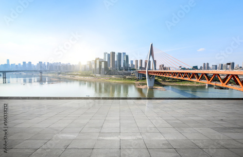 Panoramic skyline and buildings with empty concrete square floor