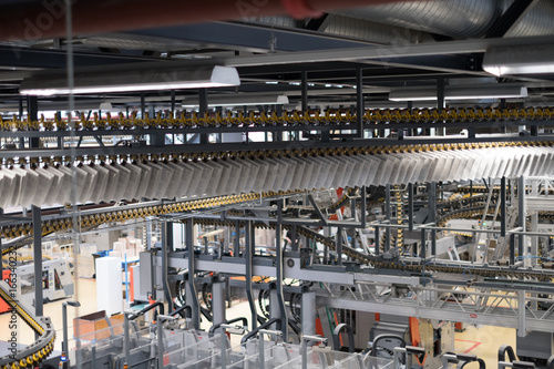 Freshly printed papers on conveyer belt 3