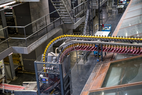 Freshly printed papers on conveyer belt