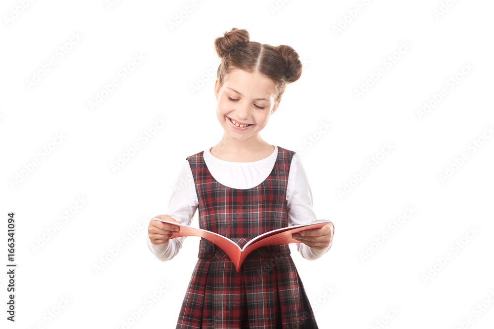 Elementary school girl reading book against white background Elementary school girl reading book against white background
