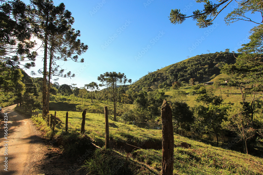 Landscape of dirt road in direction of city Goncalves. Minas Gerais State - Brazil