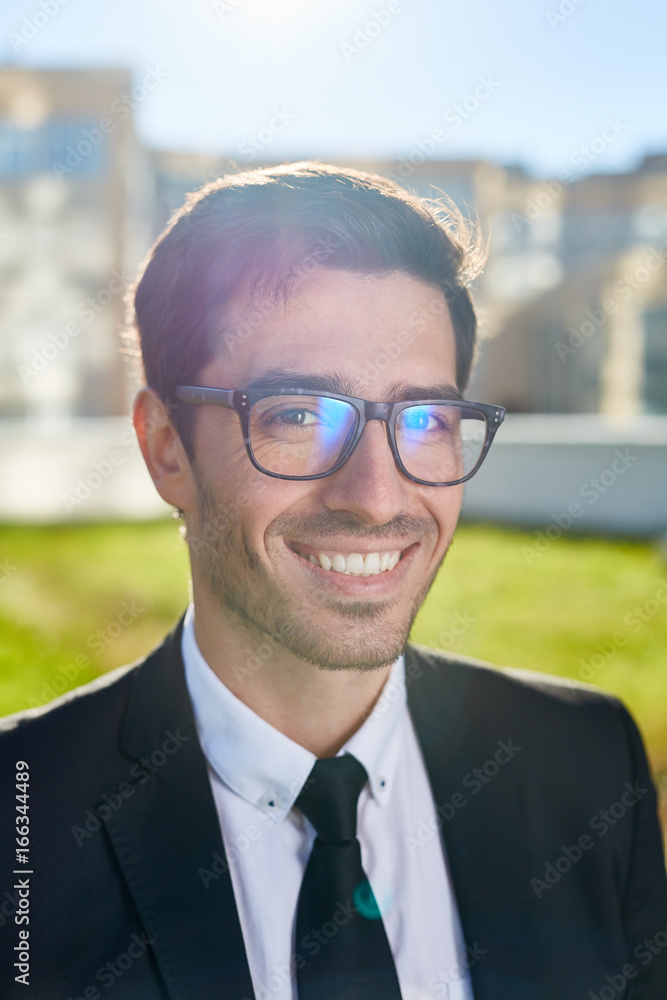 Handsome man in formalwear and eyeglasses looking at camera Handsome man in formalwear and eyeglasses looking at camera