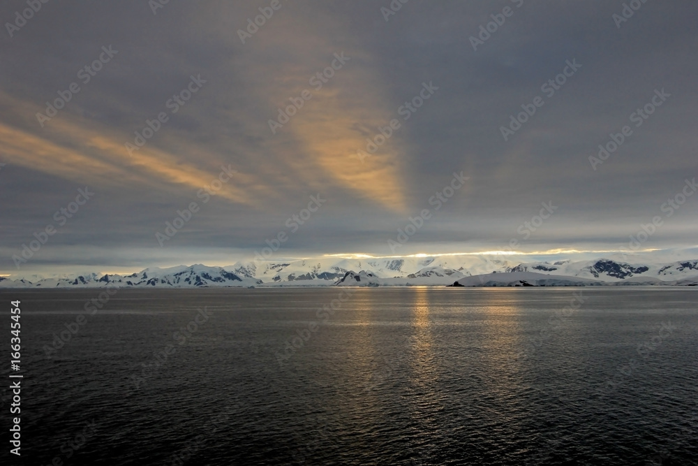 Antarctica landscape, icebergs, mountains and ocean at sunrise, Antarctica Antarctica landscape, icebergs, mountains and ocean at sunrise, Antarctica
