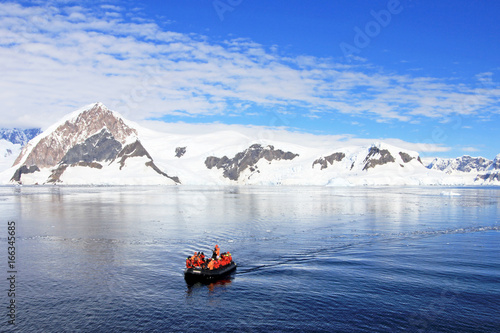 Inflatable boat full of tourists, watching for whales and seals, Antarctic Peninsula, Antarctica