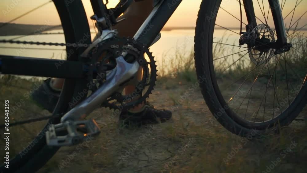 Close up cyclist went up mountain coast enjoy sunset rapid slow motion Close up cyclist went up mountain coast enjoy sunset rapid slow motion