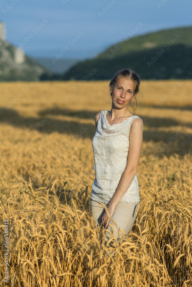 Beautiful woman in wheat at sunset. Beautiful woman in wheat at sunset.