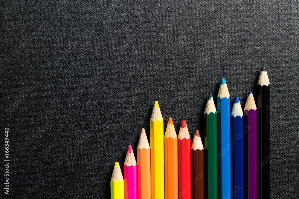 Color pencils on black background,top view Color pencils on black background,top view