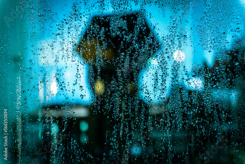 Rain drop on the glass with refection.