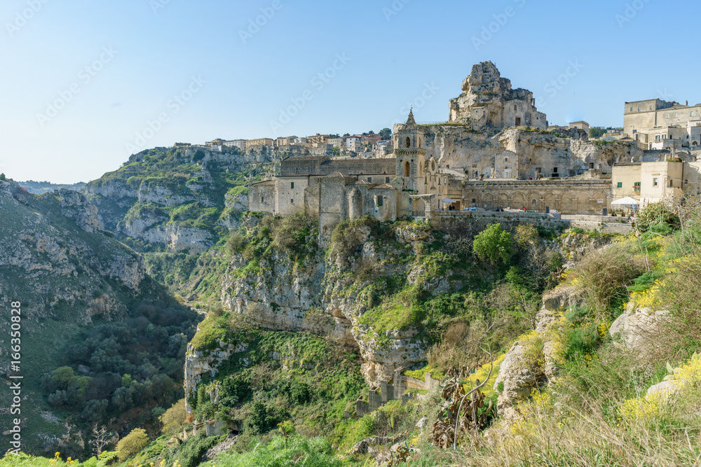 ancient ghost town of Matera (Sassi di Matera) in beautiful sun shine with blue sky, southern Italy