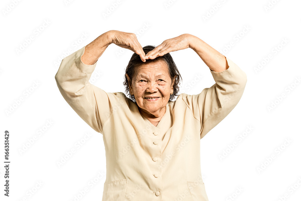Portrait of a mature woman smiling and showing love sign hand. Isolated on white background with clipping path Portrait of a mature woman smiling and showing love sign hand. Isolated on white background with clipping path