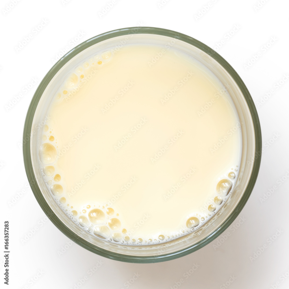 Glass of soya milk with froth isolated on white from above. Glass of soya milk with froth isolated on white from above.
