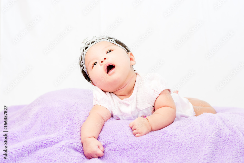 Portrait of sleeping baby lying on blanket with head band Portrait of sleeping baby lying on blanket with head band