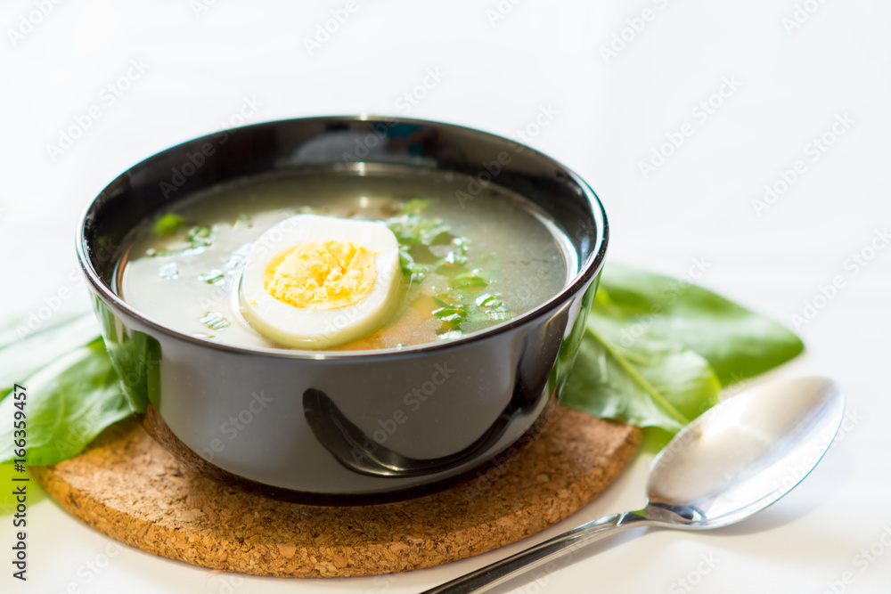 A fresh green soup with spinach sorrel egg potato A fresh green soup with spinach sorrel egg potato