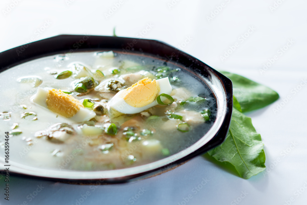 A fresh green soup with spinach sorrel egg potato