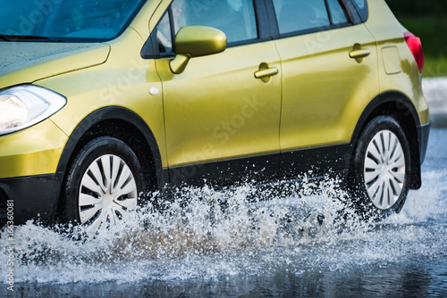 car rain puddle splashing water