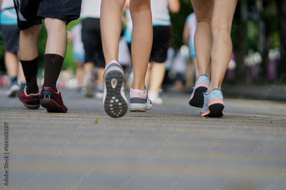 © Somkiat - Rear view of competitive marathon running. © Somkiat - Rear view of competitive marathon running.