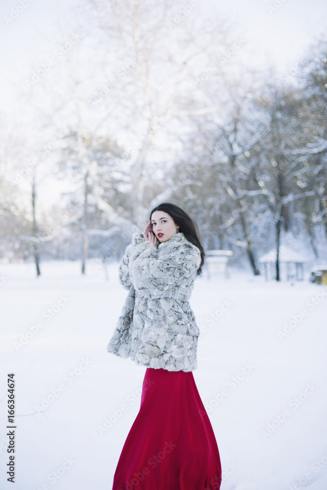 Young woman in fur coat Young woman in fur coat