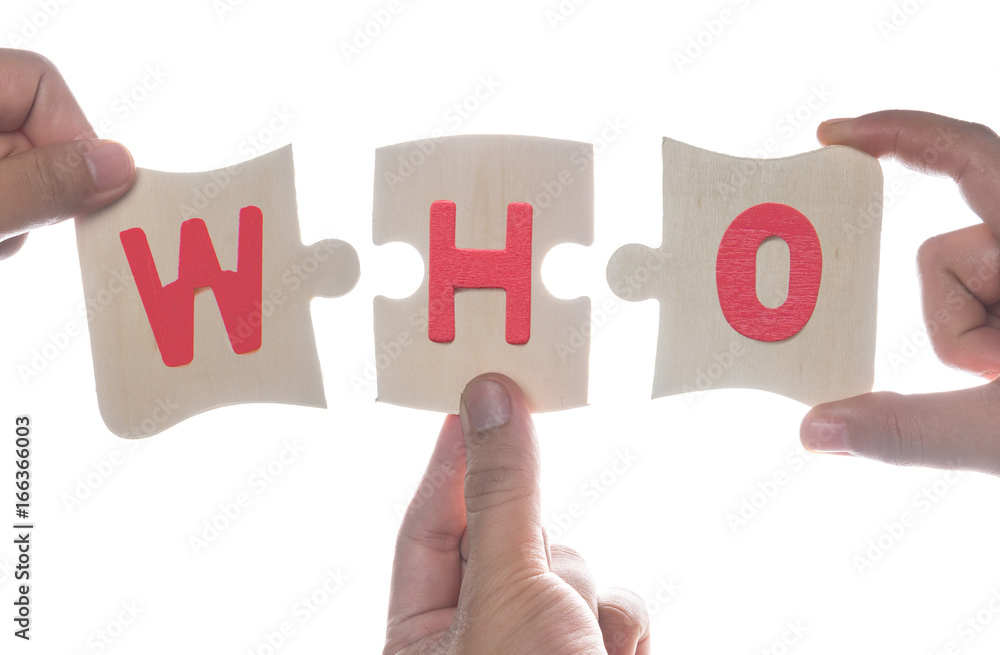 Hand holding wooden jigsaw puzzles with the word Hand holding wooden jigsaw puzzles with the word