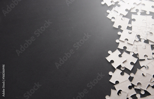 Puzzle pieces on a black slate with Text Space