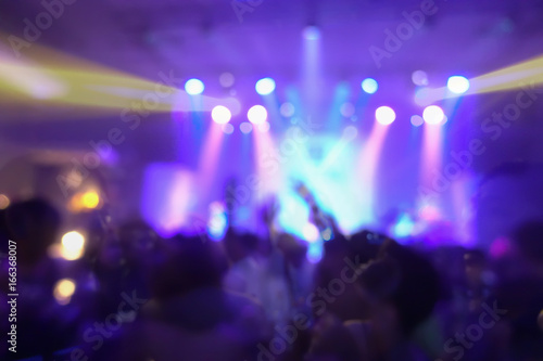 Fototapeta Naklejka Na Ścianę i Meble -  Blur background of concert crowd in front of bright stage lights musics