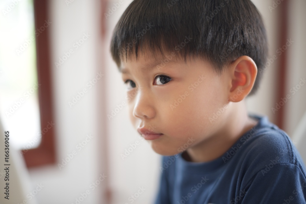 Close up a little boy looking up Close up a little boy looking up